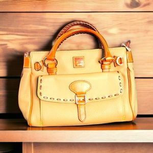 The Dooney & Bourke satchel in brown and tan is a stylish and practical